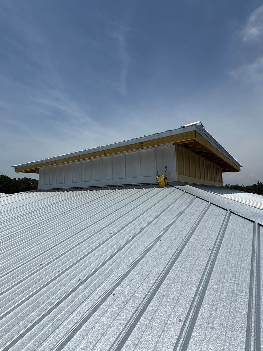 Freshly painted metal roof on a waterfront pier shed in Bon Secour, Alabama