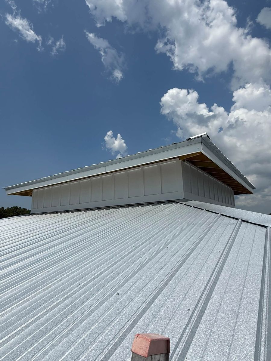 Painted metal roof and white shed walls on a Bon Secour pier